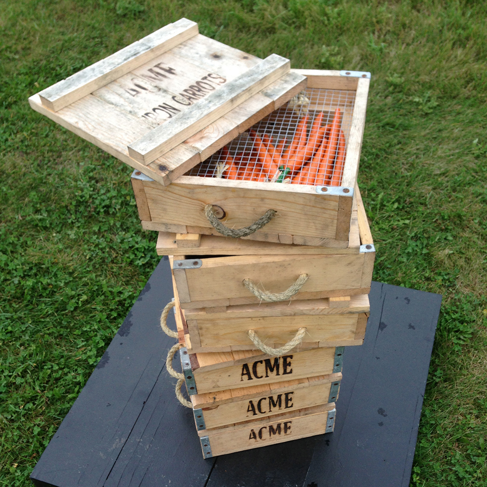 A stack of small wooden crates, stamped 