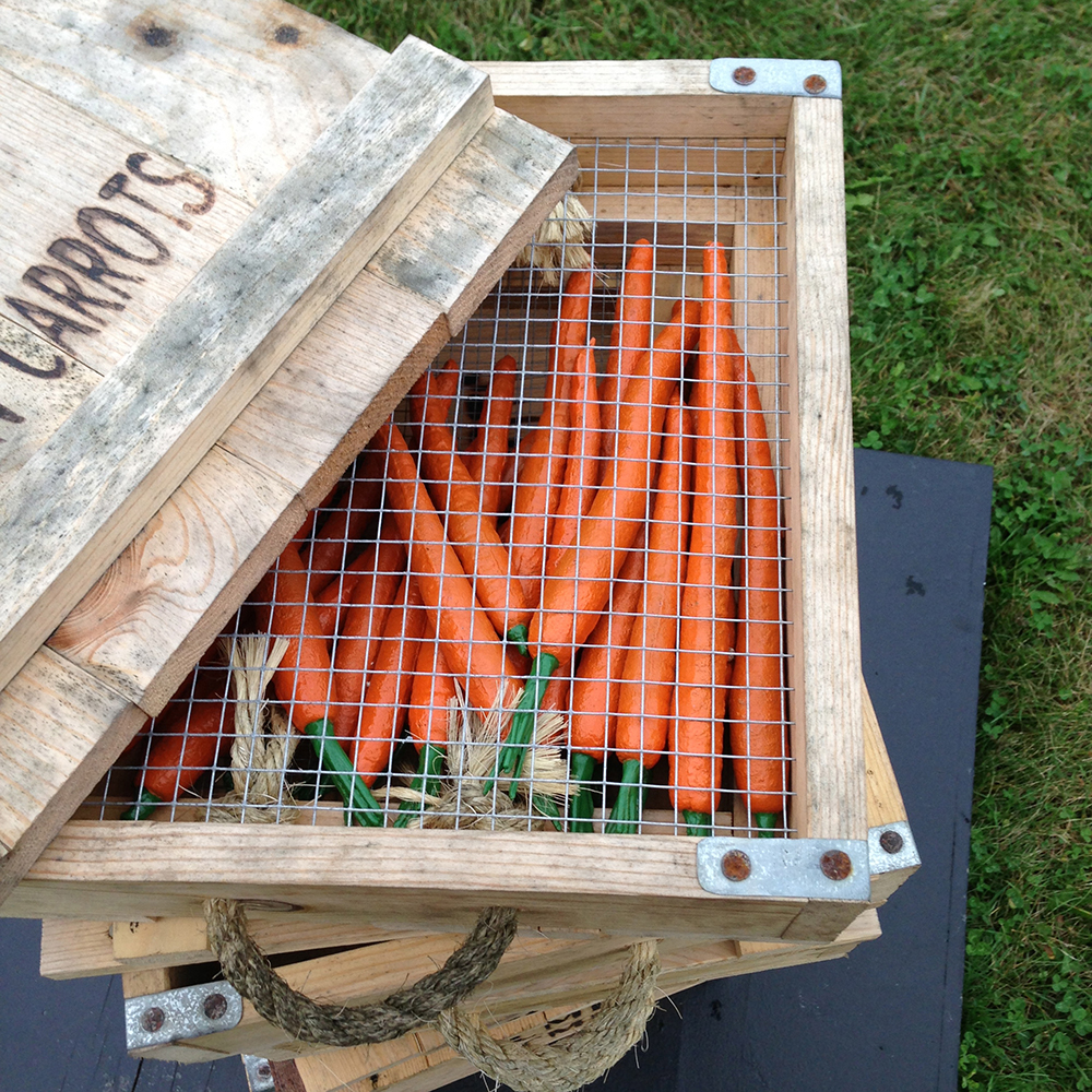 A stack of small wooden crates, stamped 